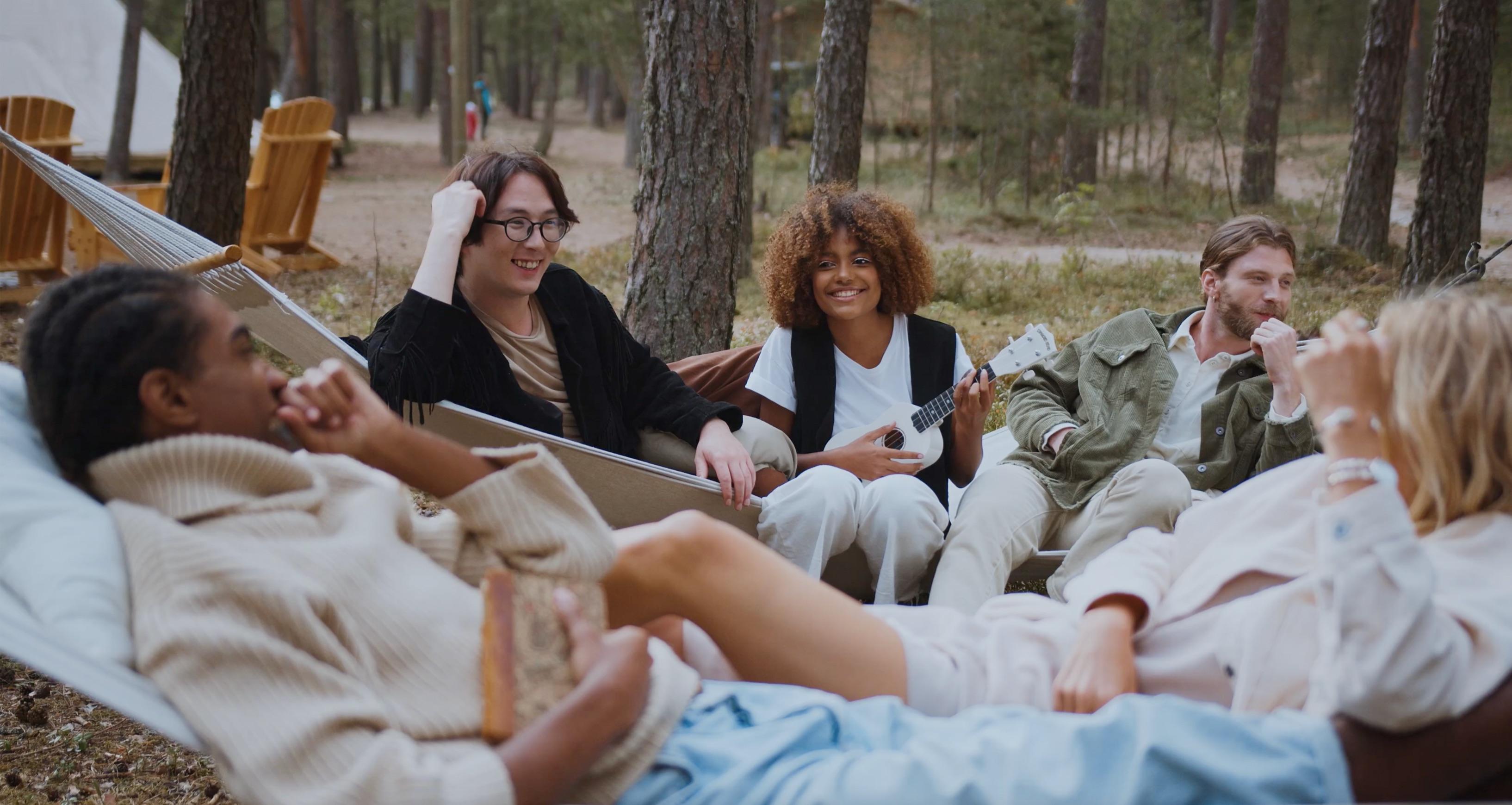 Image showing a group of people at a campsite relaxing and having fun